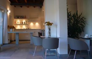 a dining room with a table and chairs and a counter at Corte di Pellio in Pellio Superiore