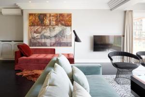 a living room with a couch and a table at Playa de La Concha 10 by FeelFree Rentals in San Sebastián