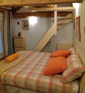 Säng eller sängar i ett rum på Rifugio Casa Lobietti