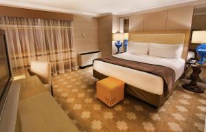 Rúm í herbergi á Caesars Atlantic City Hotel & Casino