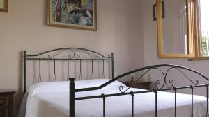 Кровать или кровати в номере Casa a Villaggio Paradiso