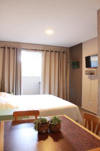 Et tv og/eller underholdning på Pousada Recanto da Estação