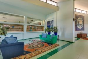 a living room with two chairs and a table at Rada Siri in Montepaone