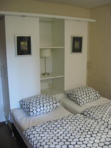 Ένα ή περισσότερα κρεβάτια σε δωμάτιο στο Den 04