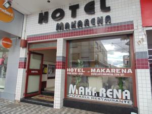 a store front of a mall with a sign on it at Hotel Makarena in Três Corações