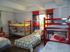 Divstāvu gulta vai divstāvu gultas numurā naktsmītnē Hostel Casa Grande