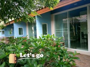a house with a sign that reads lets go at Q Zone Boutique House in Phra Nakhon Si Ayutthaya