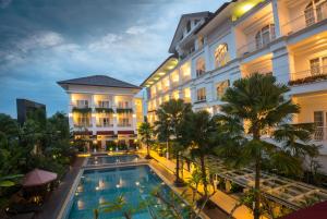 an image of a hotel with a swimming pool at Gallery Prawirotaman Hotel in Yogyakarta