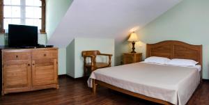 Ένα ή περισσότερα κρεβάτια σε δωμάτιο στο Hotel Brigitte