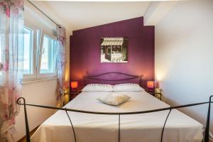 Posteľ alebo postele v izbe v ubytovaní Apartmani Maksan
