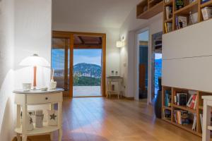 a living room with a table with a lamp on it at Country Domos Tramentu in Ozieri