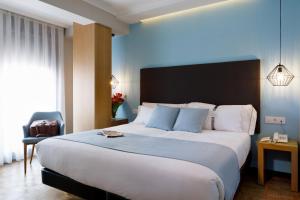 Posteľ alebo postele v izbe v ubytovaní Hotel Val Convention