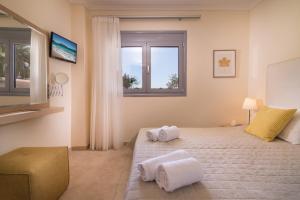 En eller flere senge i et værelse på Allea Hotel and Apartments