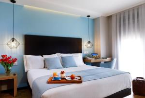 Posteľ alebo postele v izbe v ubytovaní Hotel Val Convention