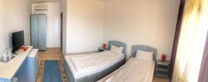 Ένα ή περισσότερα κρεβάτια σε δωμάτιο στο Complex Scorpion