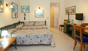 Postel nebo postele na pokoji v ubytování Apartamentos Carabela II + 7 fotografií