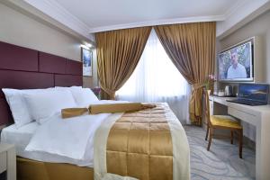 Кровать или кровати в номере New Marathon Hotel