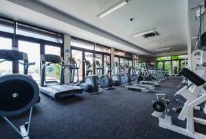 a gym with rows of treadmills and machines at Aquamarine in Eden Island