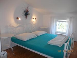 Postel nebo postele na pokoji v ubytování Apartments Blue Sea