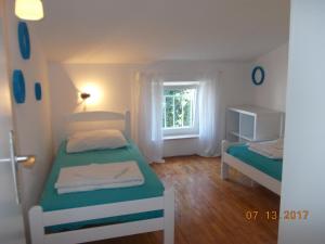 Postel nebo postele na pokoji v ubytování Apartments Blue Sea