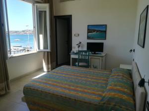 Postel nebo postele na pokoji v ubytování Hotel Nido D'aquila