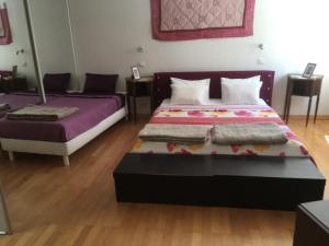 a bedroom with two beds in a room at Villa Cemaste in Montpellier