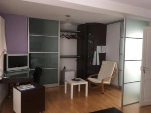 a living room with a desk and a computer monitor at Villa Cemaste in Montpellier