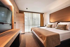 Postel nebo postele na pokoji v ubytování Rikli Balance Hotel – Sava Hotels & Resorts