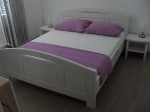מיטה או מיטות בחדר ב-Rooms Natalija