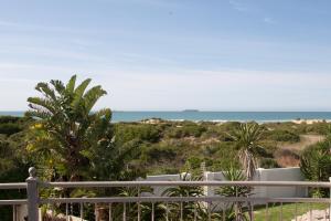 a view of the ocean from the balcony of a house at House Haven Guesthouse in Port Elizabeth