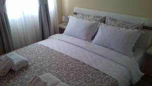 מיטה או מיטות בחדר ב-Apartments Delić