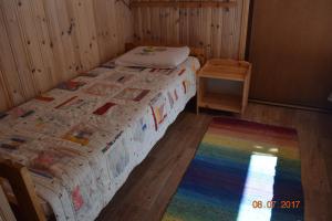 Ένα ή περισσότερα κρεβάτια σε δωμάτιο στο Lomakoti Tuulensuoja