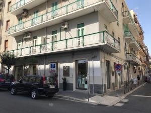 a black suv parked in front of a building at Donna Margharet in Crotone