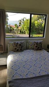 Кровать или кровати в номере Auckland Clifftop
