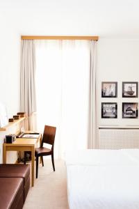 מיטה או מיטות בחדר ב-Hotel Brandenburger Tor Potsdam