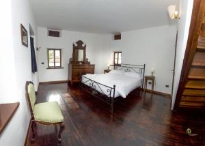 Albergo Diffuso Balcone sul Friuliにあるベッド