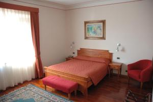 Letto o letti in una camera di Hotel Rutiliano