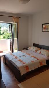 Postel nebo postele na pokoji v ubytování Apartman Marija