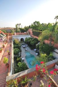 an overhead view of a garden with a swimming pool at Palais Dar Donab in Marrakesh