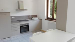 a kitchen with a sink and a stove at Terrazza sugli Ulivi in Riva del Garda