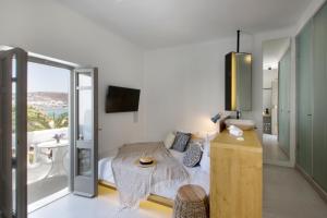 Postel nebo postele na pokoji v ubytování Dreambox Mykonos Suites