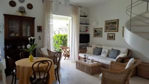 a living room with a couch and a table at Casa Amore by Holiday World in Santa Margherita Ligure