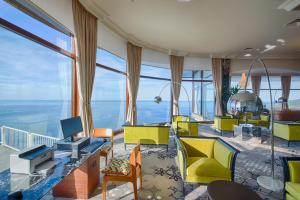 a living room with a view of the ocean at Mercure Monte Igueldo in San Sebastián