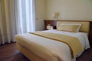 Postel nebo postele na pokoji v ubytování Hotel Bellavista