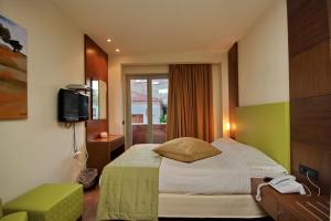 Postel nebo postele na pokoji v ubytování Astros Beach Boutique Hotel