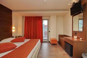 Postel nebo postele na pokoji v ubytování Astros Beach Boutique Hotel