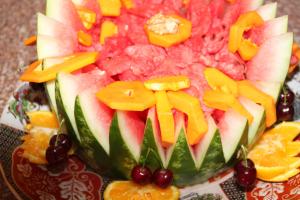 a fruit salad on a plate with fruits on it at Riad Les Chtis D'Agadir in Agadir
