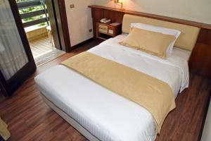 Postel nebo postele na pokoji v ubytování Hotel Bellavista