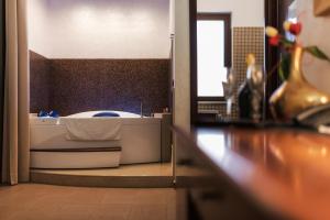 Voodi või voodid majutusasutuse Hotel Flora toas