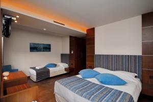 Postel nebo postele na pokoji v ubytování Astros Beach Boutique Hotel + 32 fotografií